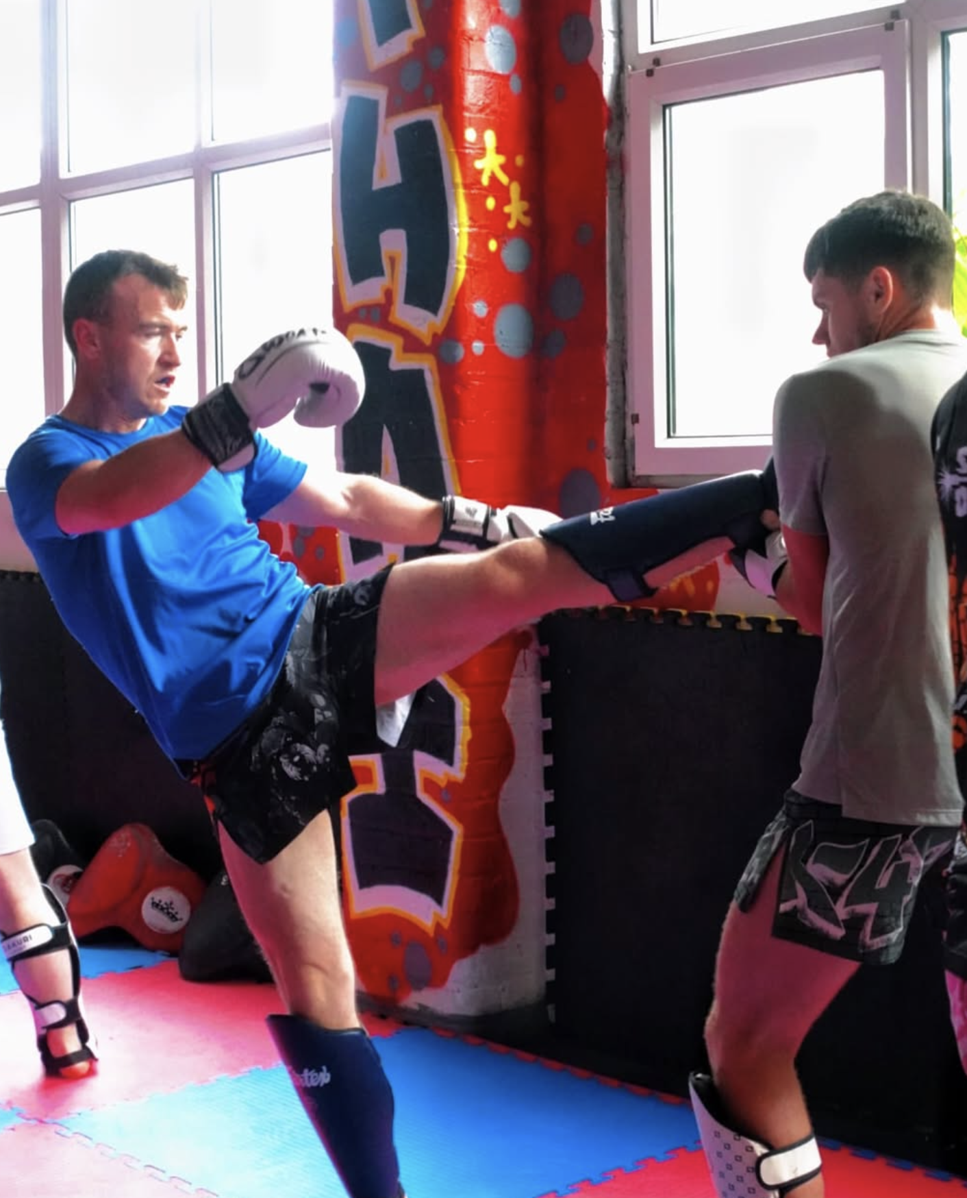 Adult Muay Thai pad work training